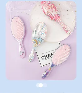 Close-up detail of cartoon unicorn hairbrushes with colorful sequins and beads inside