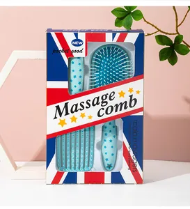 Detail of two-piece star print massage hairbrush set in British flag design box