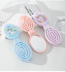 Portable hairbrush set with built-in mirror featuring cute cartoon unicorn prints.