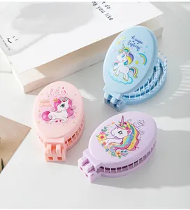 Compact folding hair brushes with colorful unicorn prints and integrated mirrors.