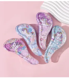 Close-up detail of cartoon unicorn detangling hairbrushes with colorful shaker beads