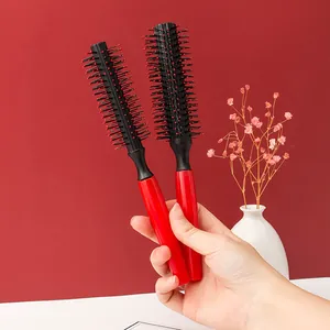 Professional red and black round hairbrush set for blow-drying and hair styling.