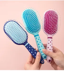 Detailed view of three colorful massage hairbrushes featuring cute star pattern handles.