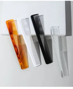 Variety of plastic fine-tooth combs in amber, white, black, and transparent colors