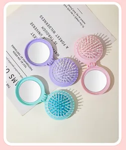 Portable 2-in-1 foldable air cushion hairbrush with vanity mirror in soft pastel tones