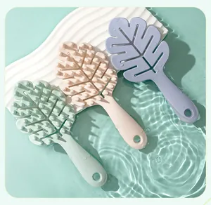 Detail showing leaf-shaped silicone shampoo brushes in water with wavy textures