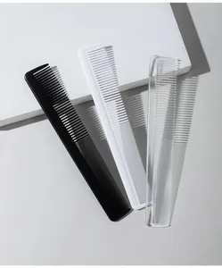 Set of three plastic fine-tooth combs in black, white, and transparent for hair styling