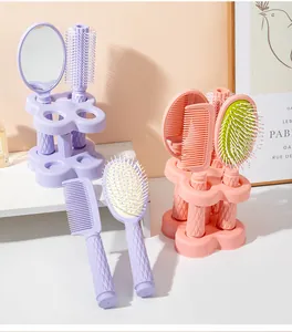 Complete 5-piece hairbrush set with stand including mirror and massage brushes in pastel colors