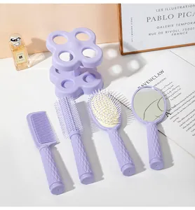 Lavender hair styling set with four brushes and mirror on a purple flower stand