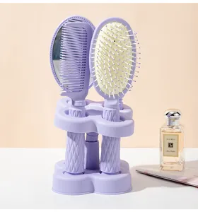 Purple 4-piece hair styling set with cushion brush, comb and mirror in a storage stand