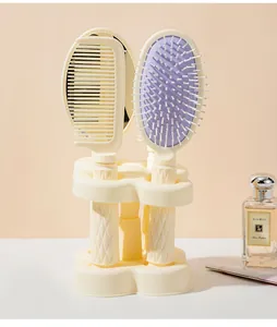 Detailed view of the 4-piece hair styling set with cream stand and lavender brush