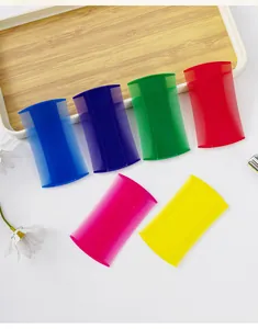Detail view of colorful double-sided fine-tooth pet flea combs for cat and dog grooming