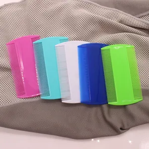 Close-up of colorful double-sided plastic fine-tooth flea combs for pet grooming