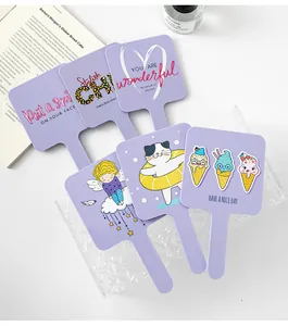 Collection of six portable purple hand mirrors featuring cute cartoon prints and quotes