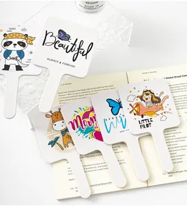 Detailed view of multiple cute cartoon designs on handheld square makeup mirrors