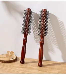 Close-up detail of professional red-brown wooden round brushes for hair curling