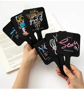 Assortment of stylish black handheld square mirrors featuring artistic English prints
