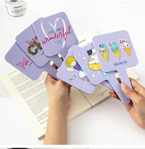 Detailed view of various lavender purple handheld square mirrors with cartoon prints