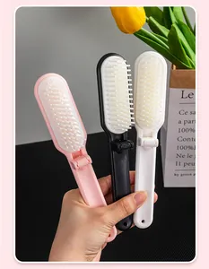 Close-up of portable folding hairbrushes with soft bristles in various colors for travel.