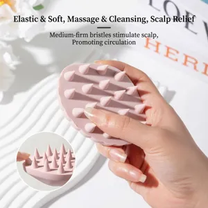 Pink shell-shaped silicone scalp massage brush for deep shampooing and hair cleaning