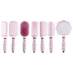 Complete pink hair brush and mirror set featuring star pattern handles for daily styling