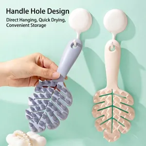 Leaf-shaped silicone hair washing brush with handle and hanging hole for scalp massage