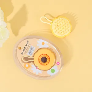 Cepillo masajeador de cuero cabelludo de silicona con diseño de girasol y lazo para colgarlo