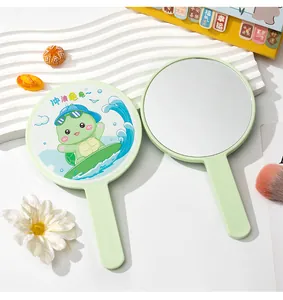 Close-up detail of a cute cartoon turtle handheld mirror with a pastel green handle