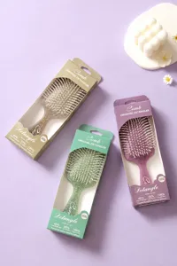 Three graphic patterned detangling hair brushes with elegant packaging boxes