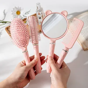Set 4 spazzole per capelli rosa con spazzola piatta, tonda, pettine e specchio a orsetto