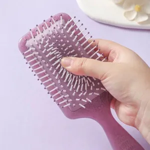 Purple square paddle hairbrush with elastic air cushion and totem print for scalp massage