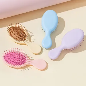 Four pastel colored mini air cushion detangling hairbrushes for kids and women
