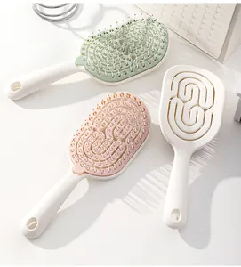 Cepillos de pelo huecos en rosa pastell, verde y blanco para dar volumen al cabello