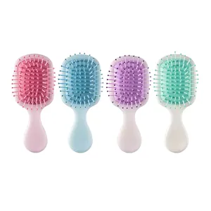 Set of four portable pearlescent mini air cushion hairbrushes in various pastel colors