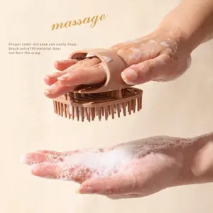 Ergonomic handheld shampoo brush for scalp massage and generating rich soapy foam