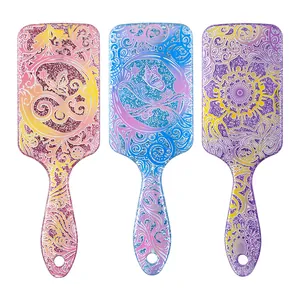 Three decorative glittery floral paddle hairbrushes with air cushions for scalp massage