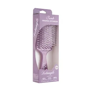 Purple square cushion hairbrush with totem print displayed in retail packaging box