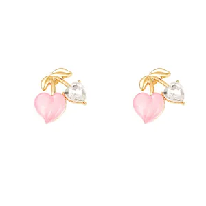 Elegant cherry-shaped stud earrings featuring pink and clear heart zircons on white backdrop