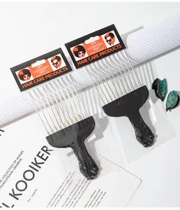 Detail of professional steel needle afro hair pick combs with fist handles.
