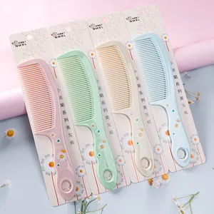 Set of four colorful daisy print hair combs for gentle detangling in pastel shades