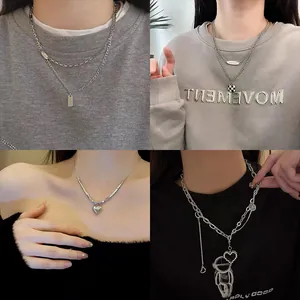 Four styles of minimalist silver titanium steel necklaces with various charms for women