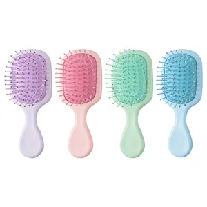 Set of four mini portable air cushion hairbrushes in pastel colors for girls