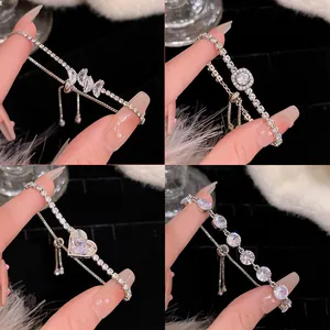 Detailed close-up of four silver zircon adjustable bracelets with heart and butterfly designs