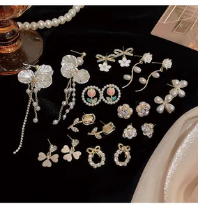 Elegant S925 silver needle earrings collection with floral, pearl, and tulip motifs