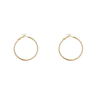 Elegant minimalist gold hoop earrings with a classic round design for daily wear