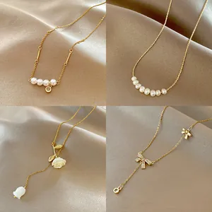 Collage of four vintage gold-plated necklaces with pearls and floral pendants