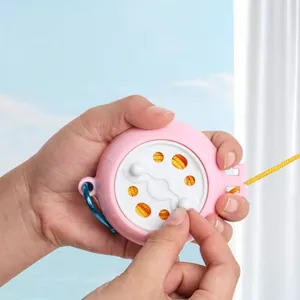 Portable retractable clothesline with pink circular case for outdoor and travel use