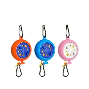 Portable retractable clothesline set for outdoor travel in orange, blue, and pink colors
