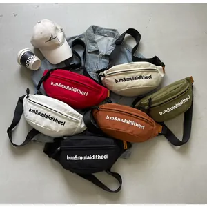Collection of colorful embroidered canvas waist bags for casual street style