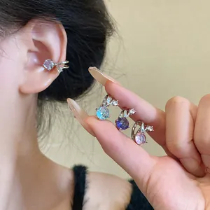 Sparkling zircon ear cuffs for non-pierced ears shown in blue, purple, and pink colors.